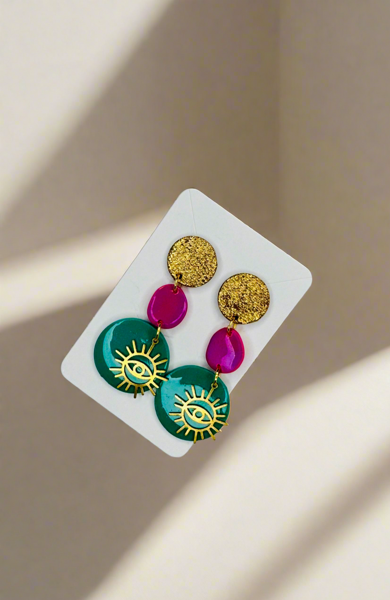 1- Long green eye earrings
