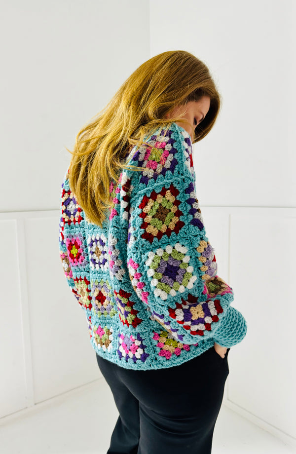 Handmade crochet jumper in turquoise blue