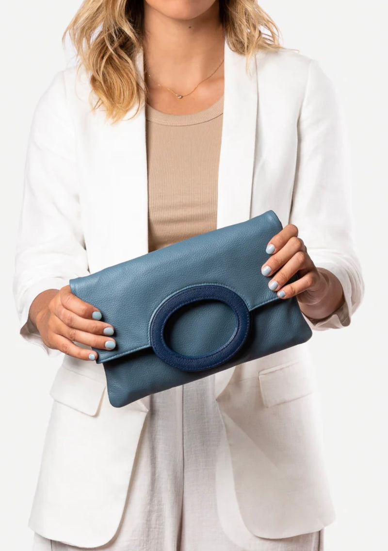 1- Cloud leather clutch in blue by Pessoa