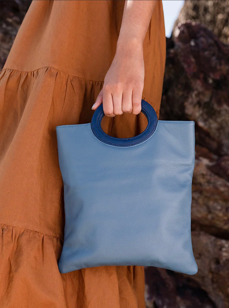 1- Cloud leather clutch in blue by Pessoa