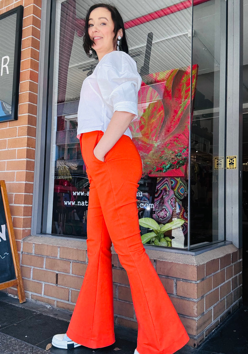 1- Flared orange high waisted pants