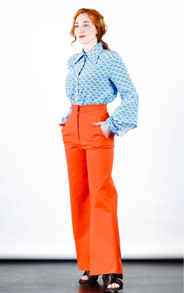 1- Orange high waisted pants by Natalija Rushidi