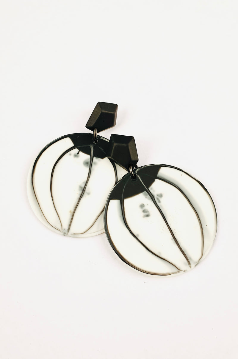 Black and white round earrings