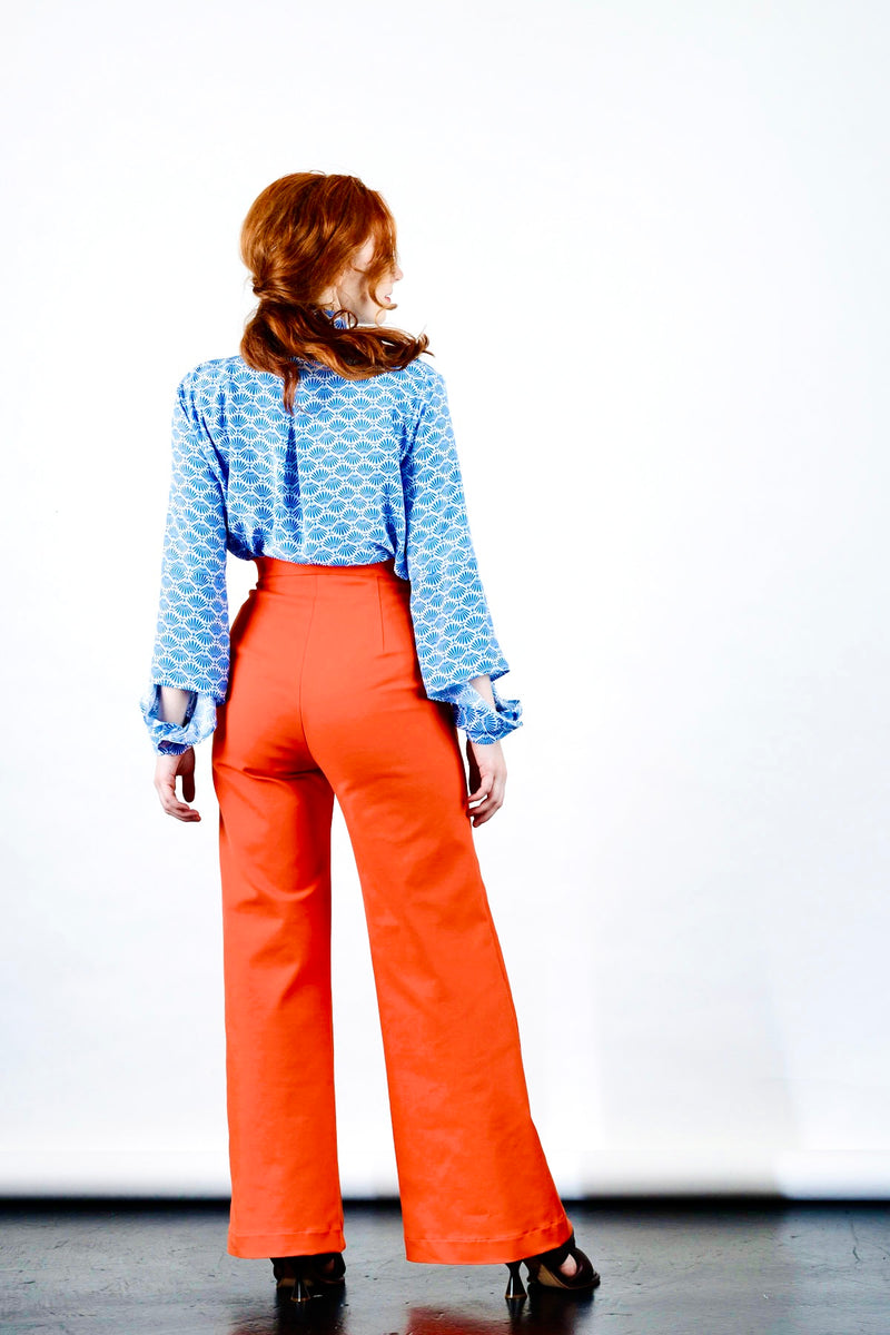 1- Orange high waisted pants by Natalija Rushidi