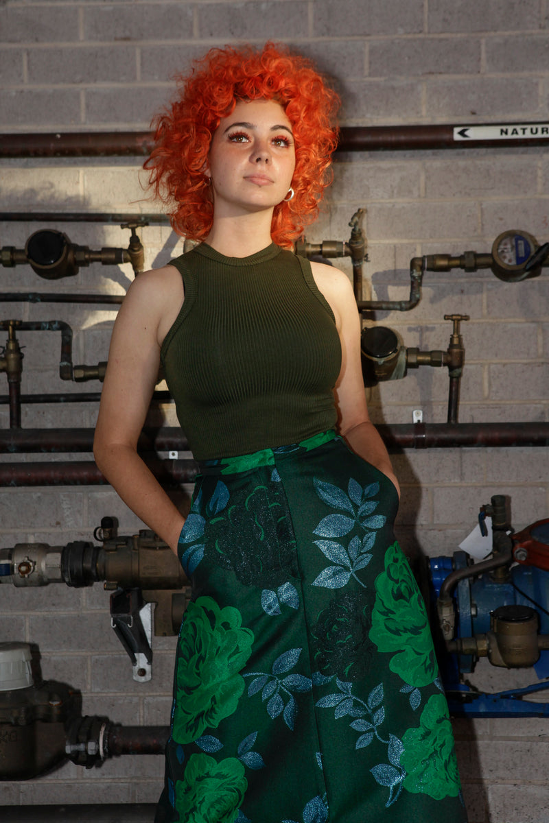 Green singlet by Natalija Rushidi