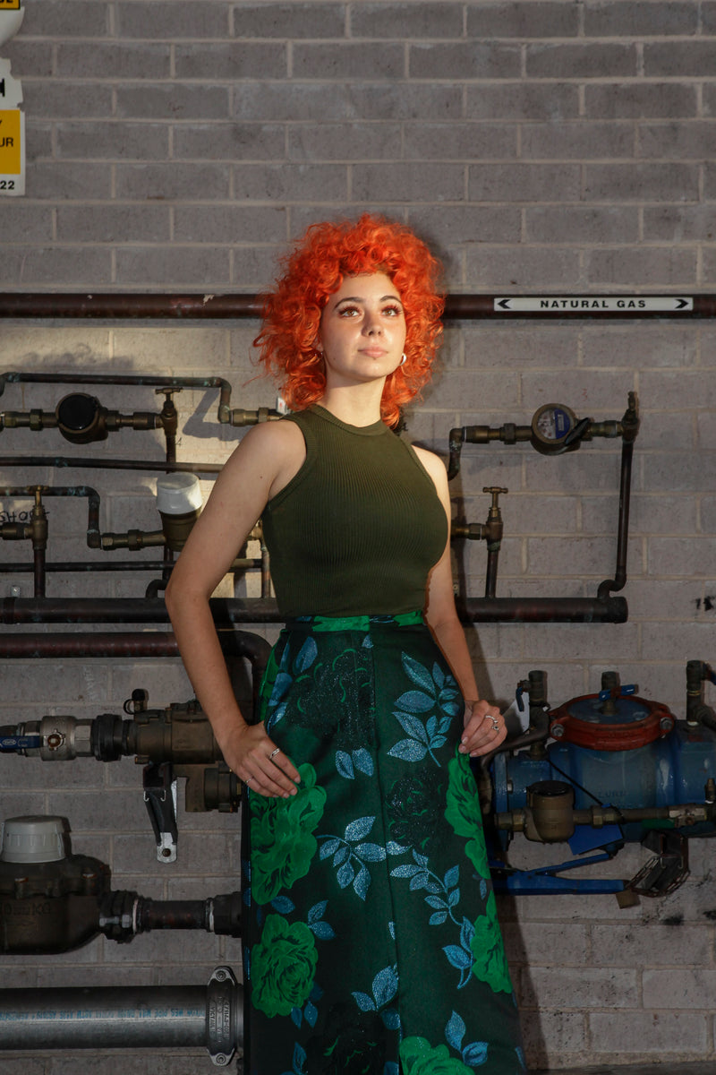 Green singlet by Natalija Rushidi
