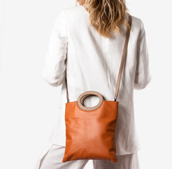 Cloud leather clutch in burnt orange by Pessoa