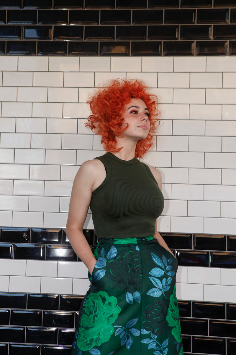 Green singlet by Natalija Rushidi