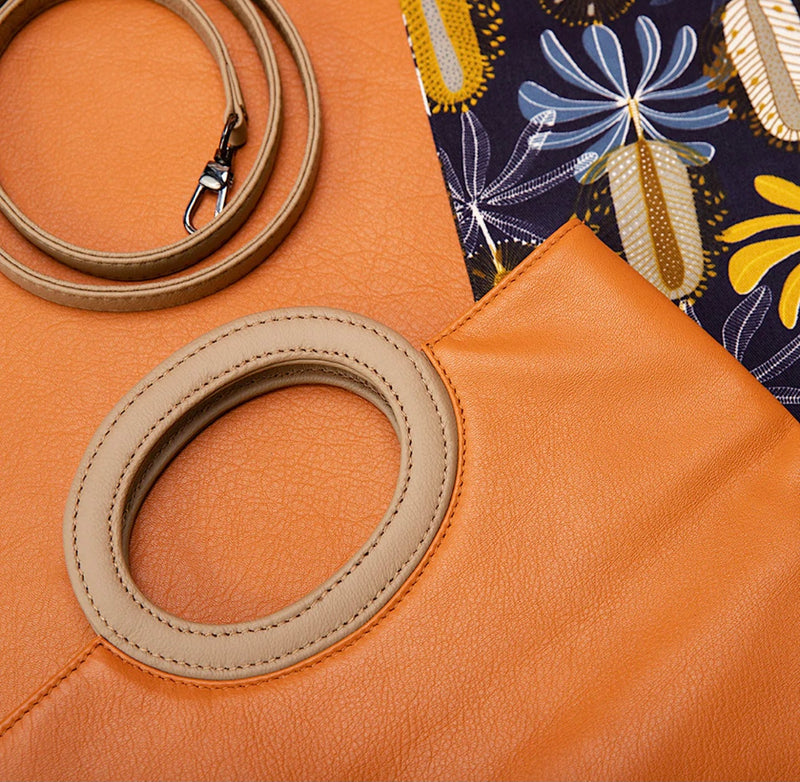 Cloud leather clutch in burnt orange by Pessoa